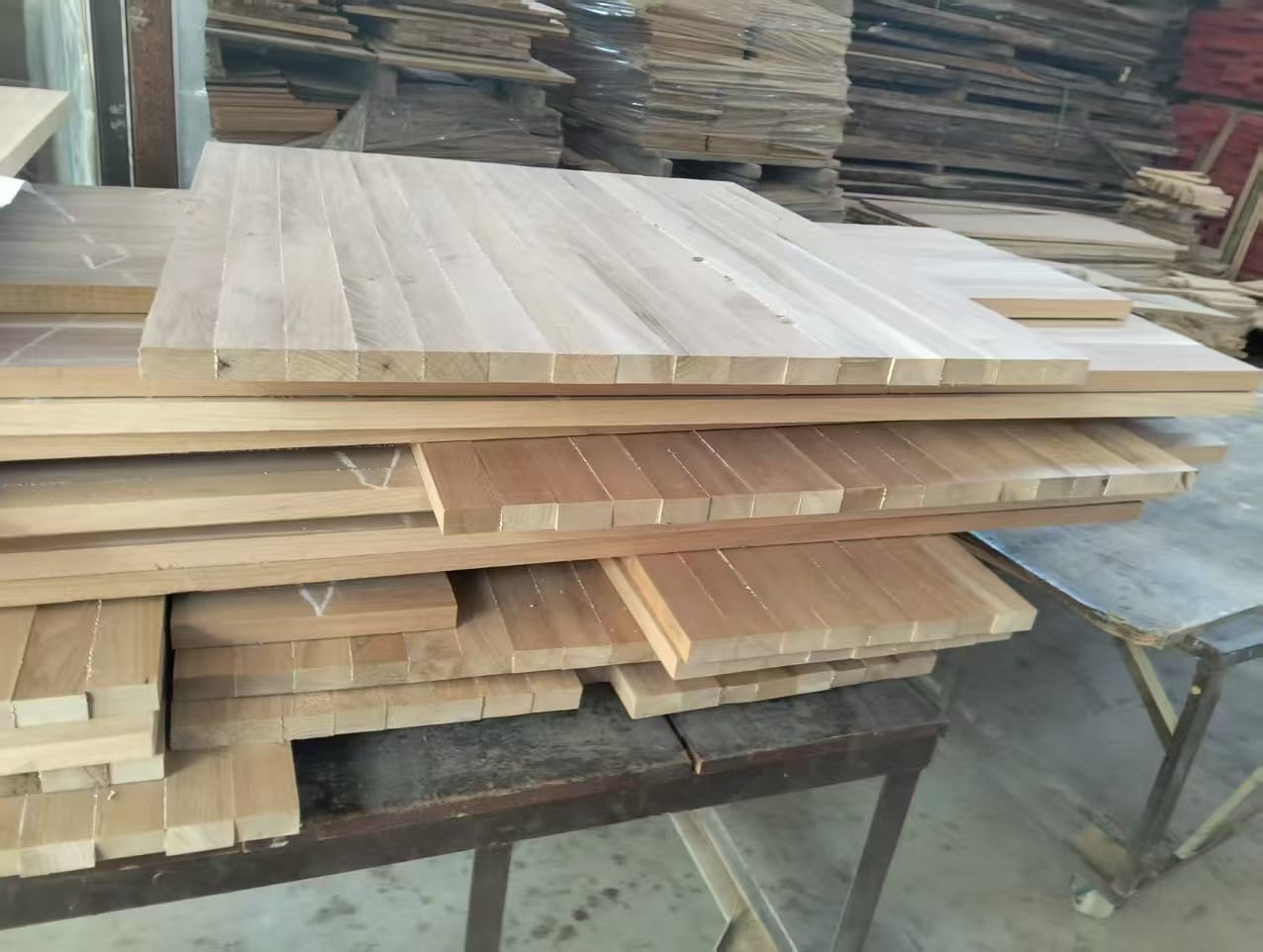 European solid oak boards used for custom solid oak vanity construction, showing rustic grade wood texture and thickness