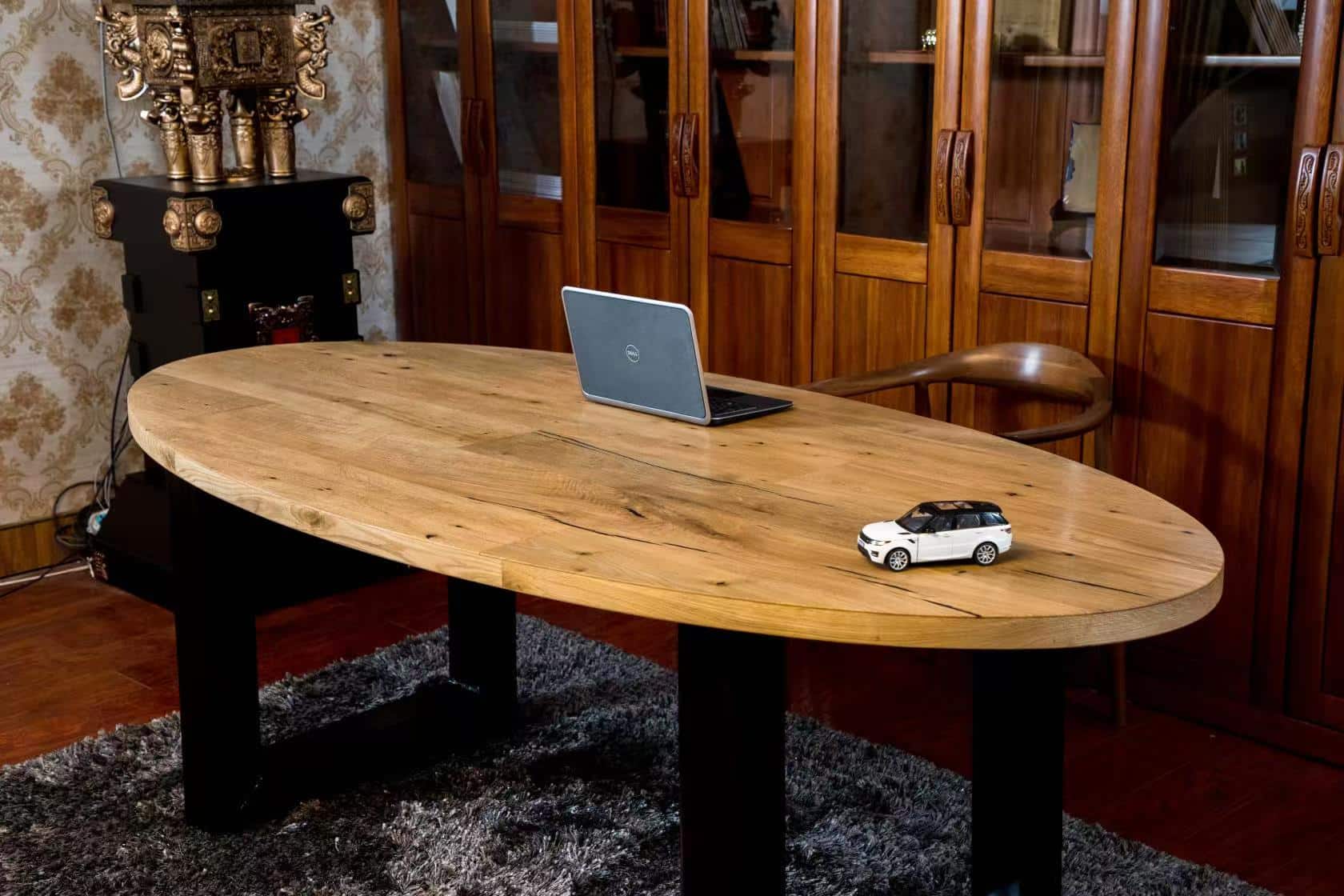 Solid oak round dining table used in hospitality dining space