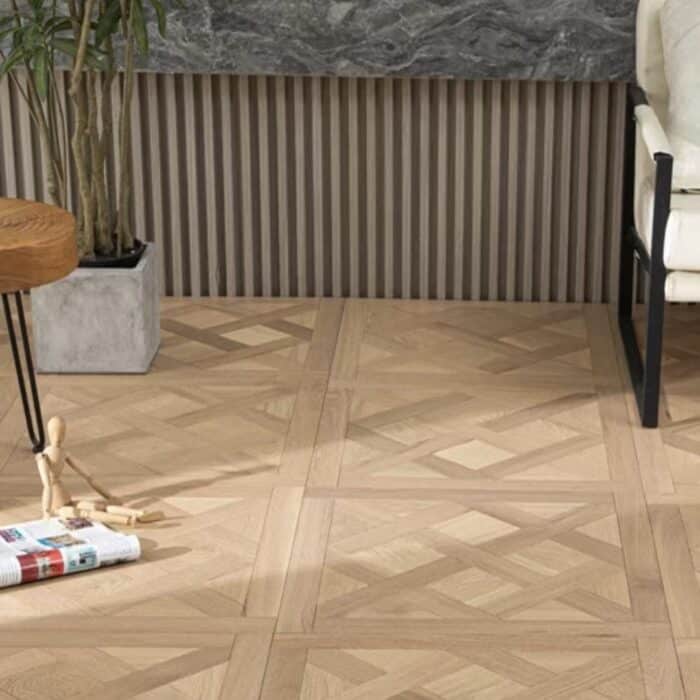 Solid oak Versailles flooring installed in interior space, showing geometric parquet panel layout and natural wood grain