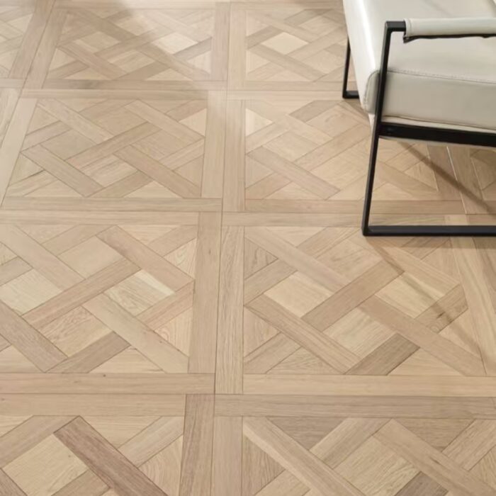 Solid oak Versailles flooring installed in interior space, showing geometric parquet panel layout and natural wood grain