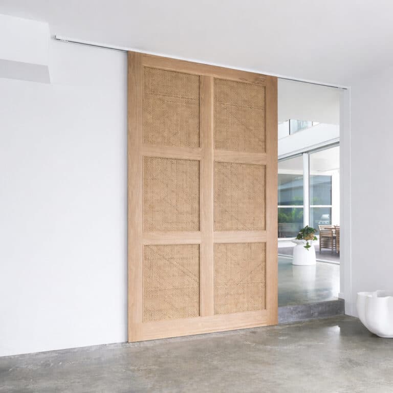 modern interior wooden sliding door with rattan panels, oak finish, minimalist home design