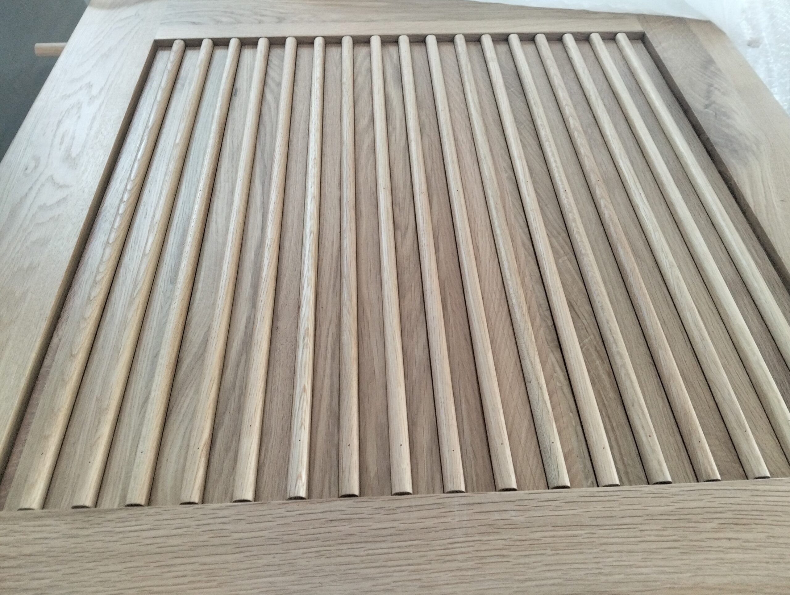 oak reeded panel detail on timber glass interior door lower section