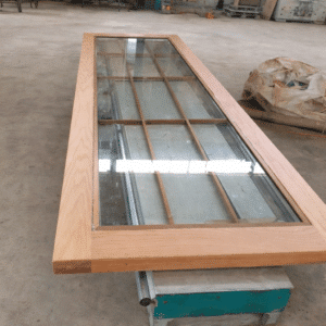 timber glass interior swing door with oak frame and reeded panel design