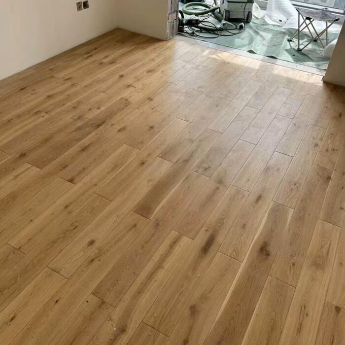light engineered wood plank flooring installed in modern residential interior
