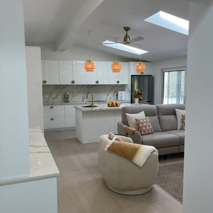 wide plank engineered oak flooring installed in open kitchen interior