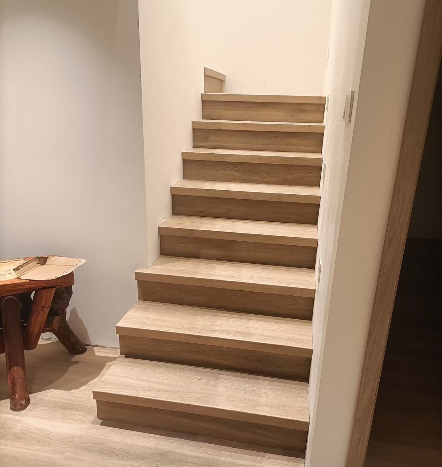 custom stair treads matching wood flooring staircase design