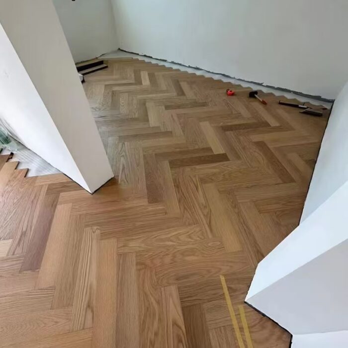 solid wood herringbone flooring used in commercial interior project