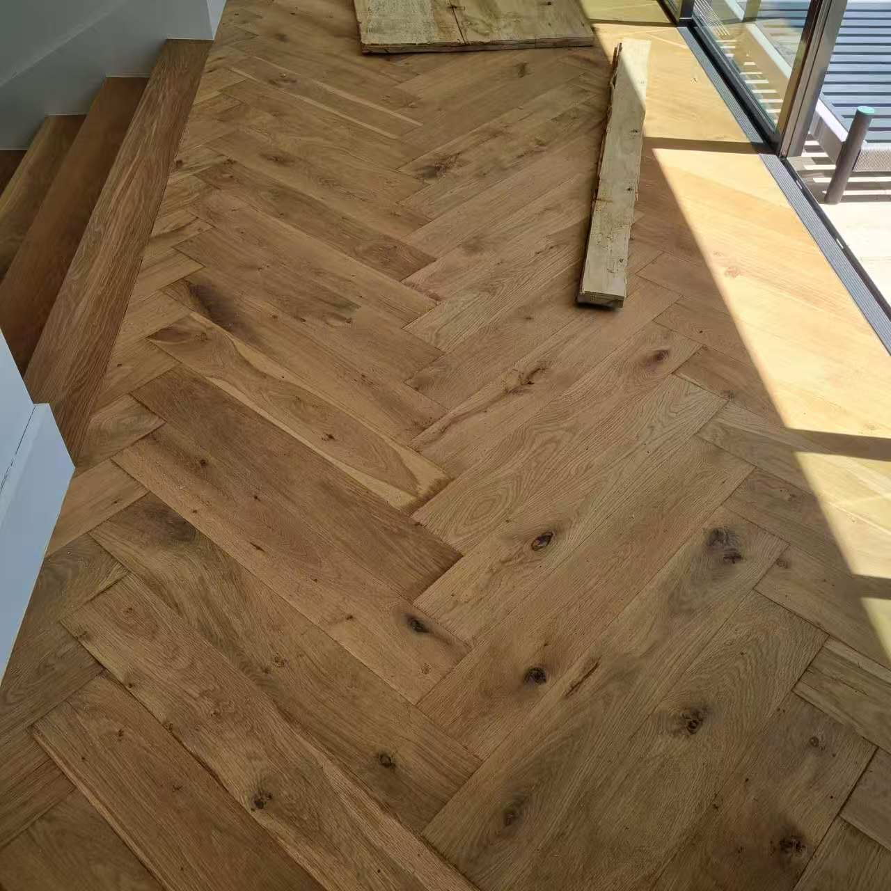 solid oak herringbone wood flooring pattern for residential and commercial interior projects